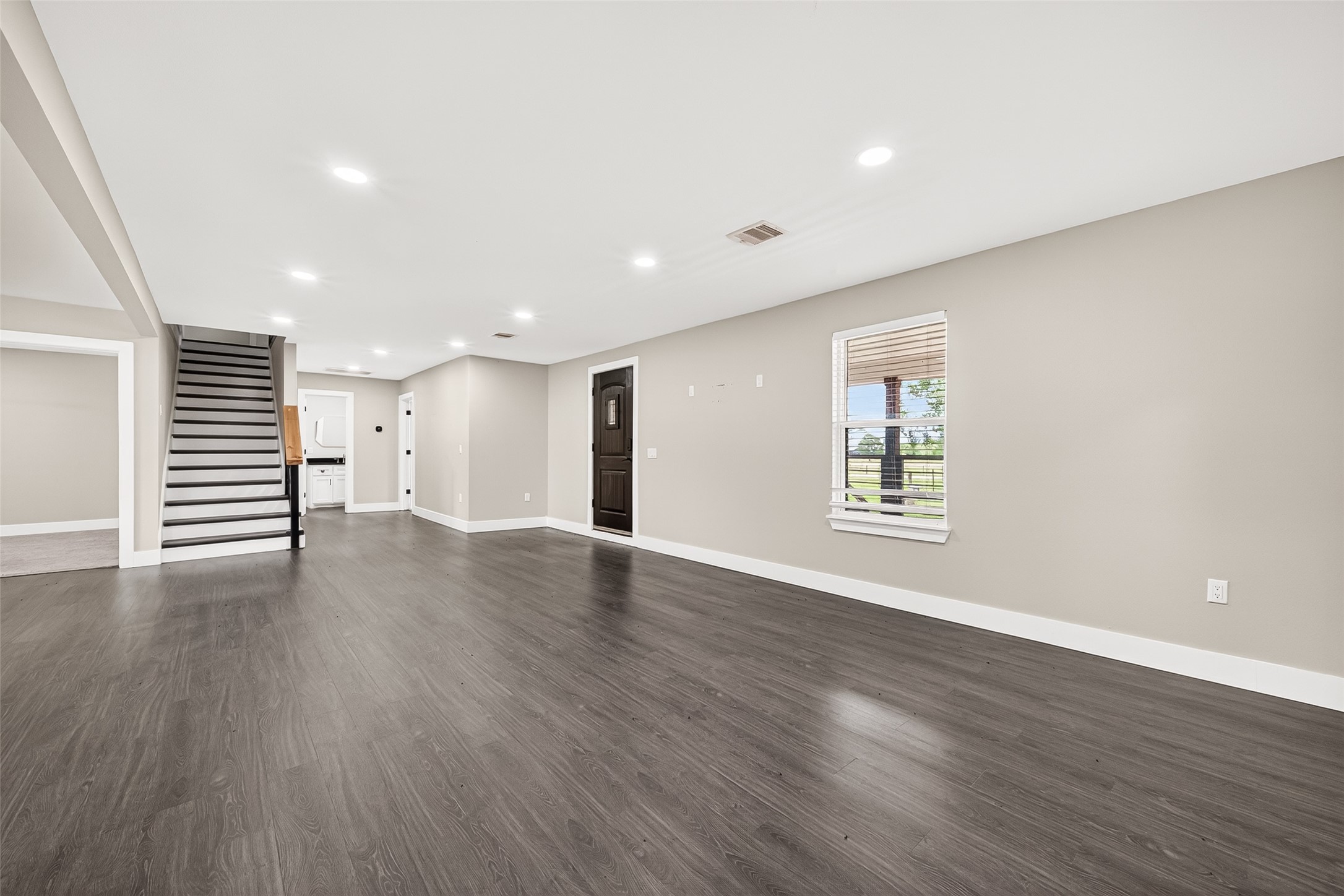 803 County Road 772 Damon, TX 77430 - Photo 19 of 50 a view of a big room with wooden floors and windows