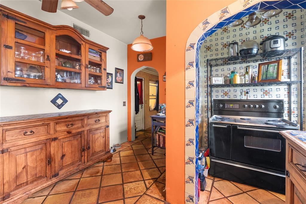 1321 28th Street North St. Petersburg, FL 33713 - Photo 14 of 31 a kitchen with stainless steel appliances granite countertop a stove and a cabinets