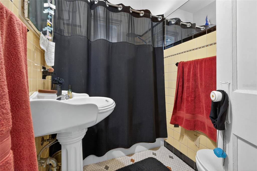 1321 28th Street North St. Petersburg, FL 33713 - Photo 17 of 21 a bathroom with a sink and a mirror