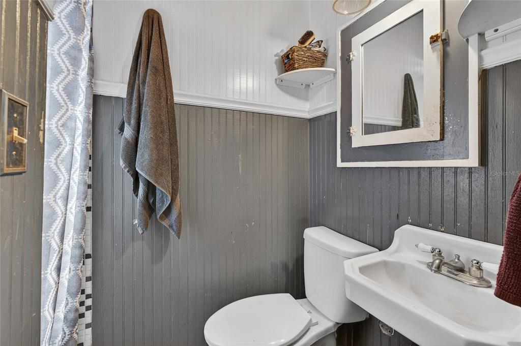 1321 28th Street North St. Petersburg, FL 33713 - Photo 19 of 31 a bathroom with a toilet and a sink