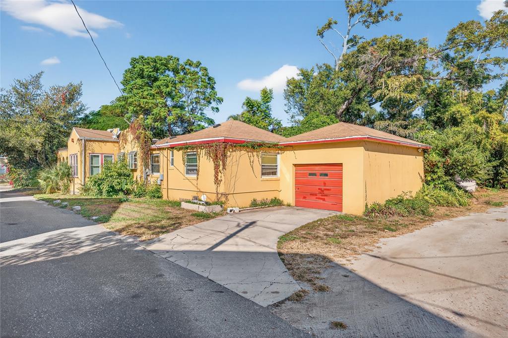 1321 28th Street North St. Petersburg, FL 33713 - Photo 2 of 21 a view of a house with a yard and large tree