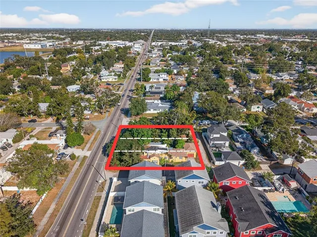 an aerial view of residential houses with outdoor space
