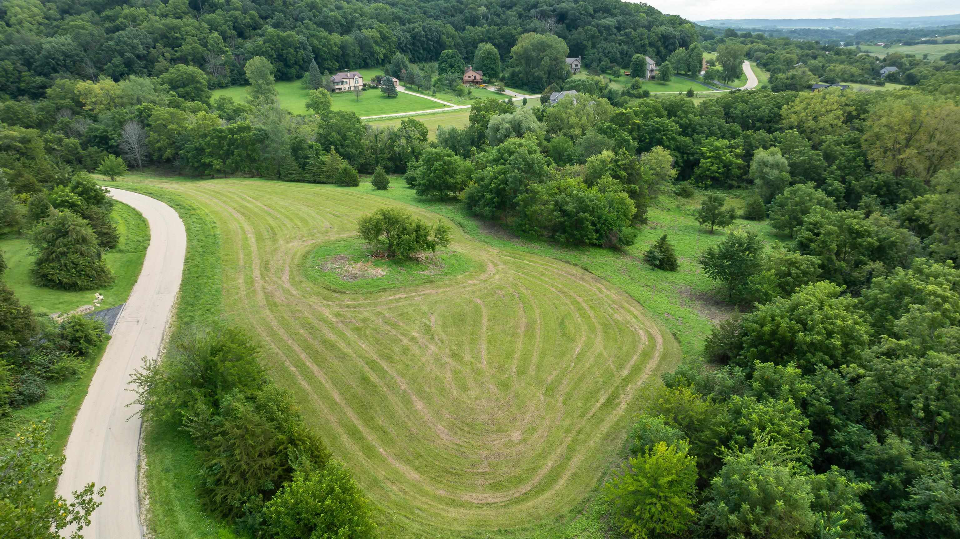 40 Heatherdowns Lane Galena, IL 61036 - Photo 11 of 13 a view of a swimming pool with a yard