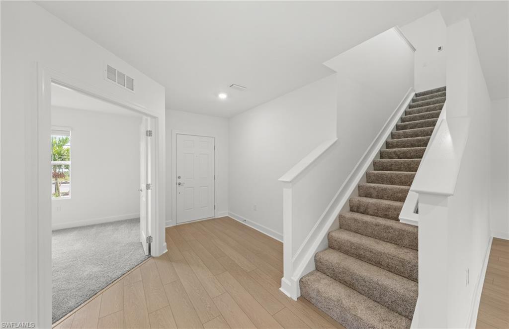 15827 Northridge Road Punta Gorda, FL 33982 - Photo 11 of 27 a view of an entryway with wooden floor