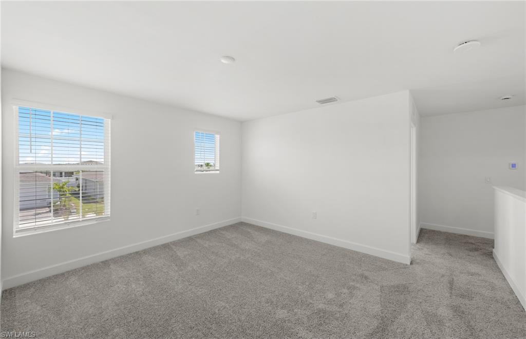 15827 Northridge Road Punta Gorda, FL 33982 - Photo 13 of 27 a view of an empty room with a window