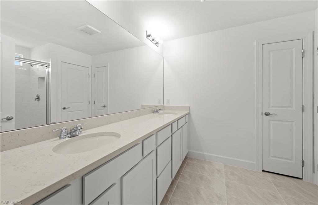 15827 Northridge Road Punta Gorda, FL 33982 - Photo 16 of 27 a bathroom with a sink and a mirror