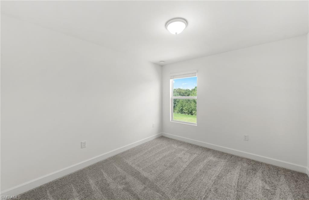 15827 Northridge Road Punta Gorda, FL 33982 - Photo 19 of 27 an empty room with a window