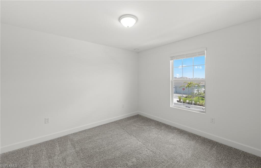 15827 Northridge Road Punta Gorda, FL 33982 - Photo 21 of 27 an empty room with a window