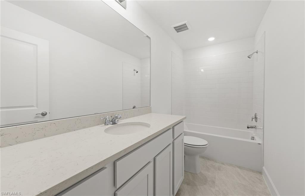 15827 Northridge Road Punta Gorda, FL 33982 - Photo 22 of 27 a bathroom with a sink a toilet and shower