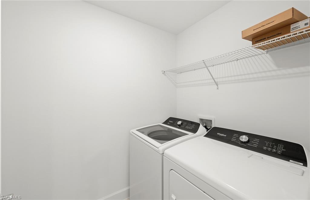 15827 Northridge Road Punta Gorda, FL 33982 - Photo 24 of 27 a utility room with dryer and washer