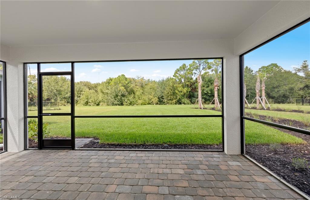 15827 Northridge Road Punta Gorda, FL 33982 - Photo 25 of 27 a view of a yard with an outdoor seating