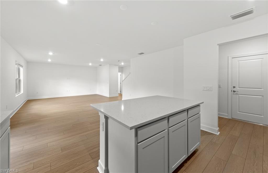 15827 Northridge Road Punta Gorda, FL 33982 - Photo 8 of 27 a kitchen with a sink cabinets and wooden floor