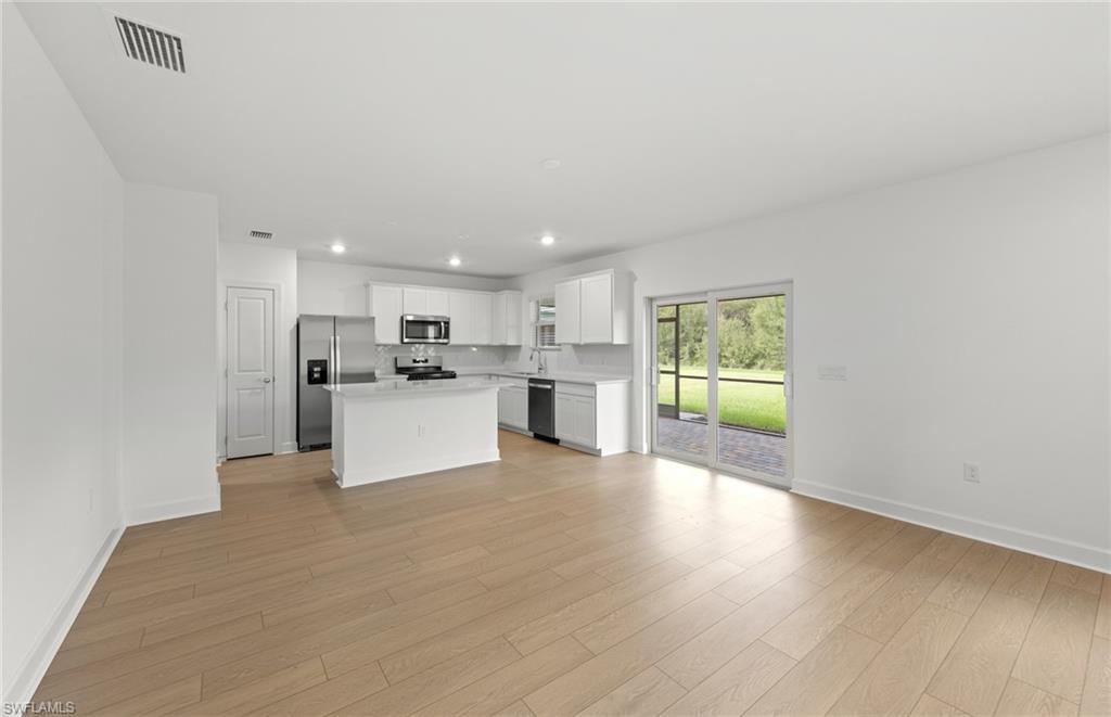 15827 Northridge Road Punta Gorda, FL 33982 - Photo 9 of 27 a view of kitchen with wooden floor