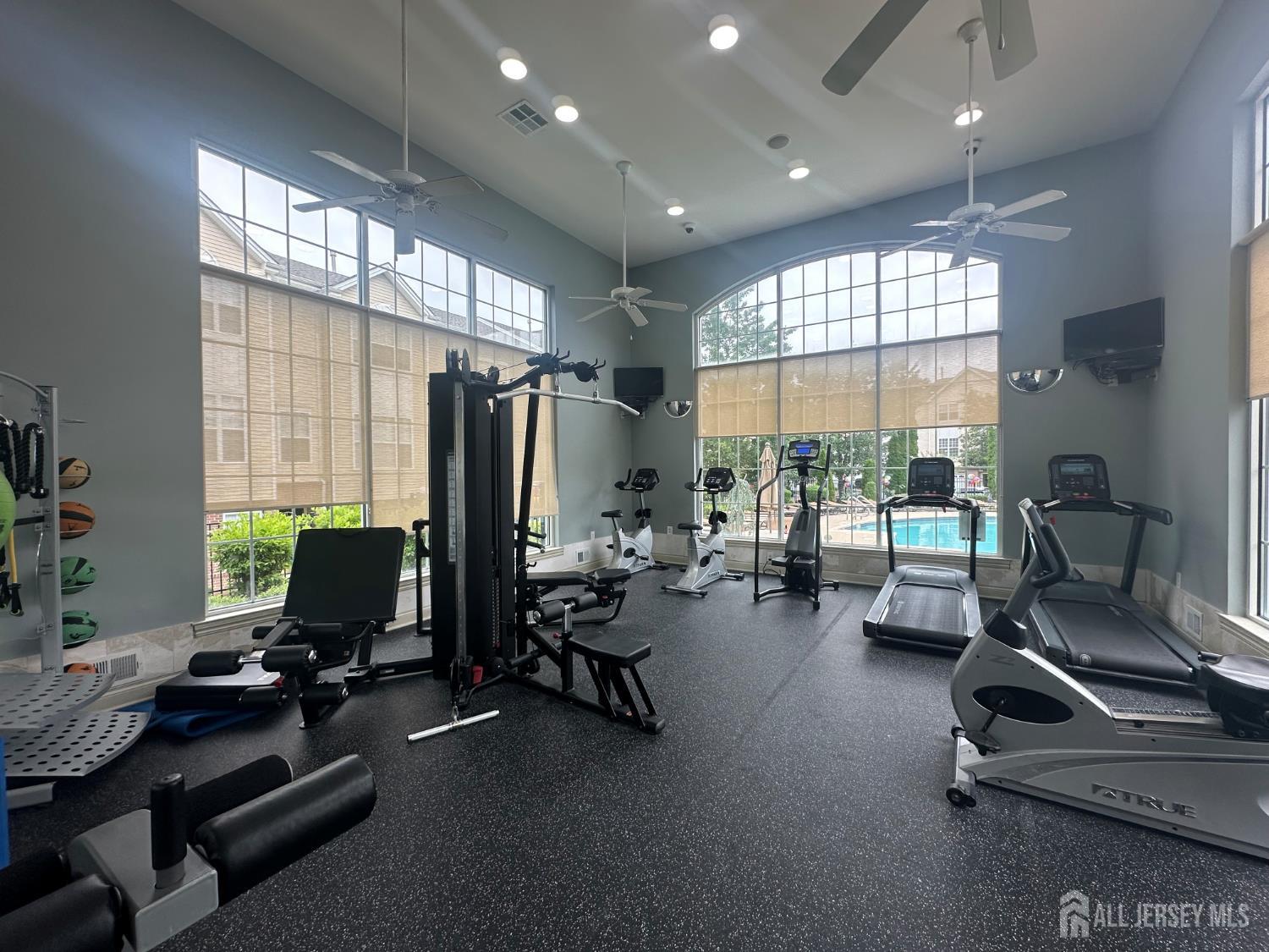17 Burdak Road Sayreville, NJ 08859 - Photo 12 of 19 a room with gym equipment and a large window
