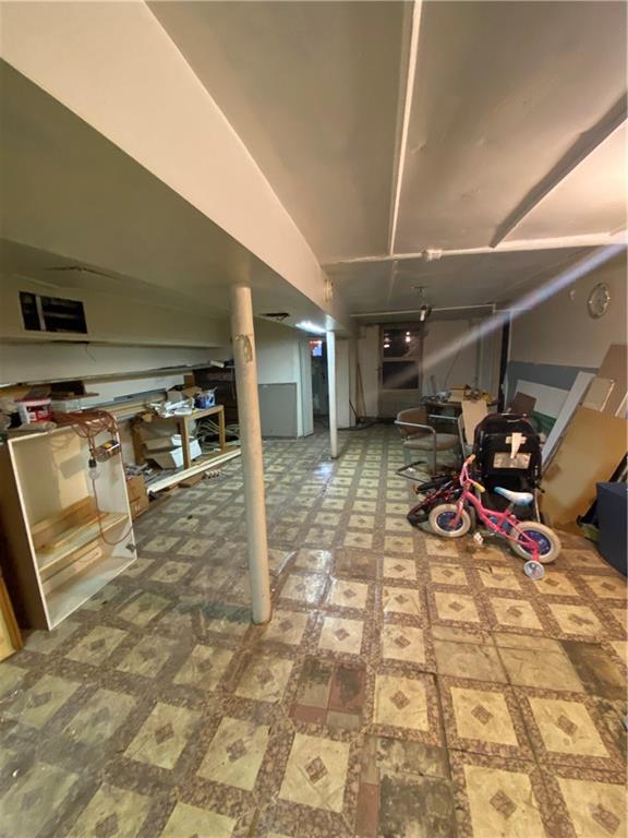 2308 Bath Avenue Brooklyn, NY 11214 - Photo 14 of 14 a view of a garage with parked cars