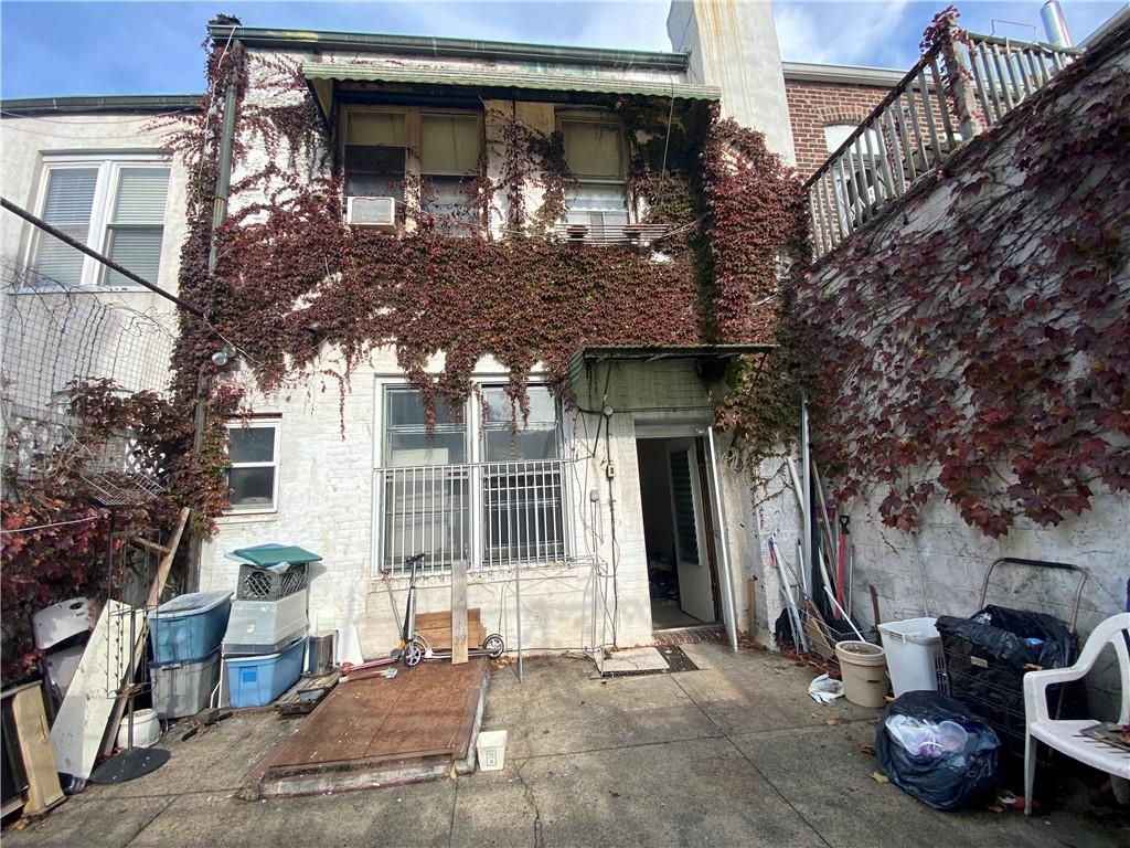2308 Bath Avenue Brooklyn, NY 11214 - Photo 3 of 14 a front view of a house with large trees