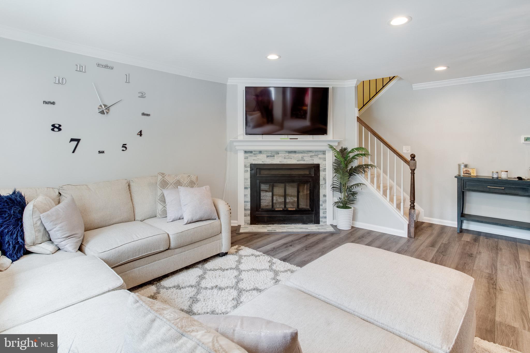 11457 Appledowre Way, Unit 2 Germantown, MD 20876 - Photo 12 of 35 Living room w/wood burning fireplace