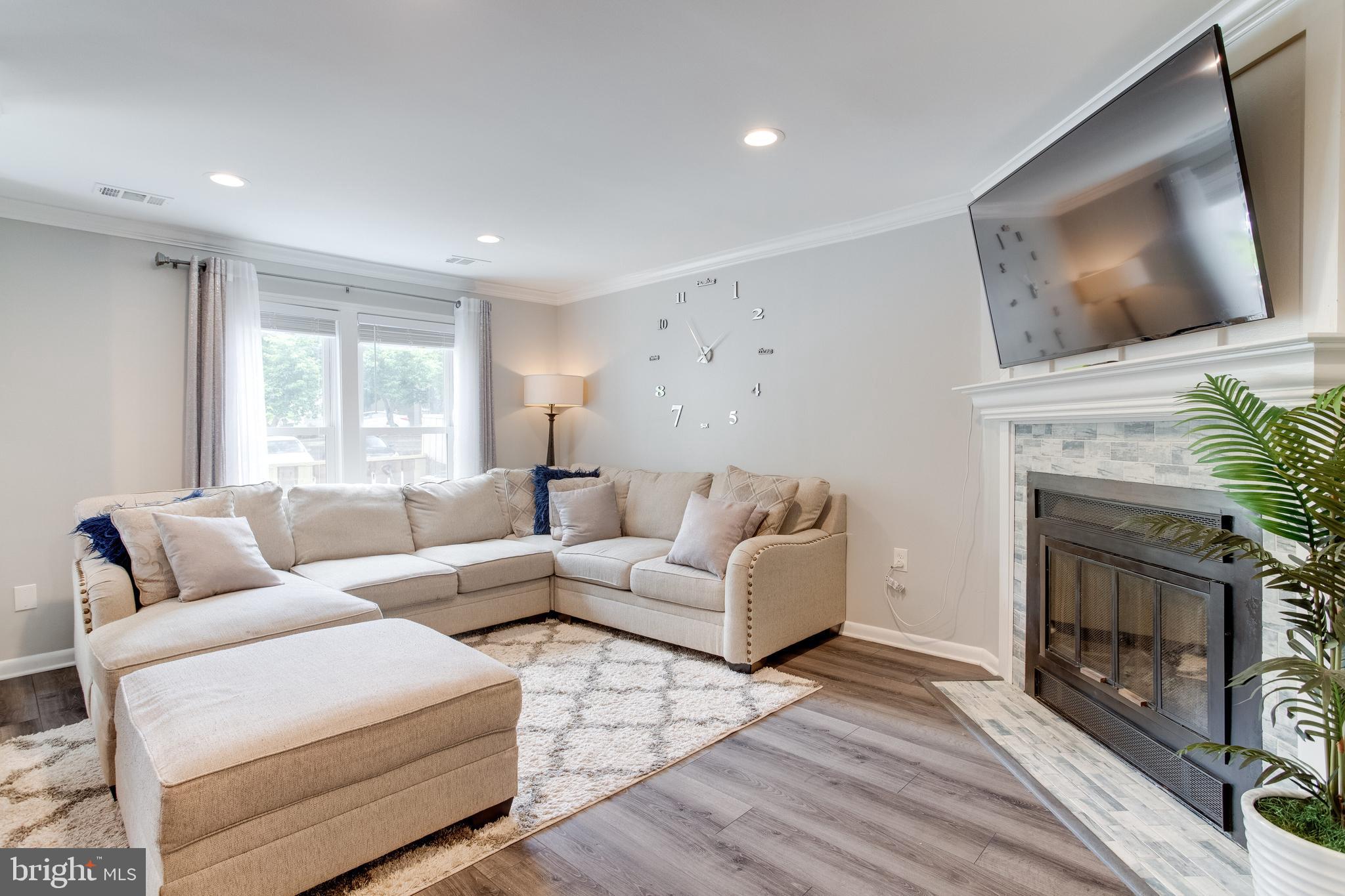 11457 Appledowre Way, Unit 2 Germantown, MD 20876 - Photo 10 of 35 Living Room w/wood burning fireplace