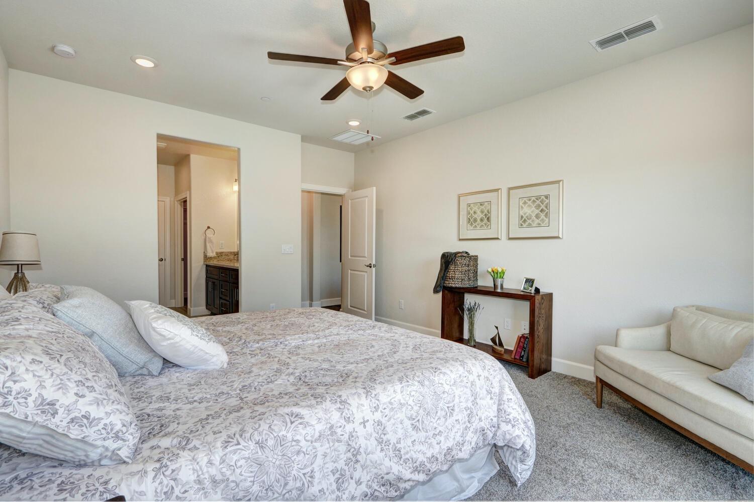 937 Norman Road Galt, CA 95632 - Photo 13 of 15 a bedroom with a bed and a couch