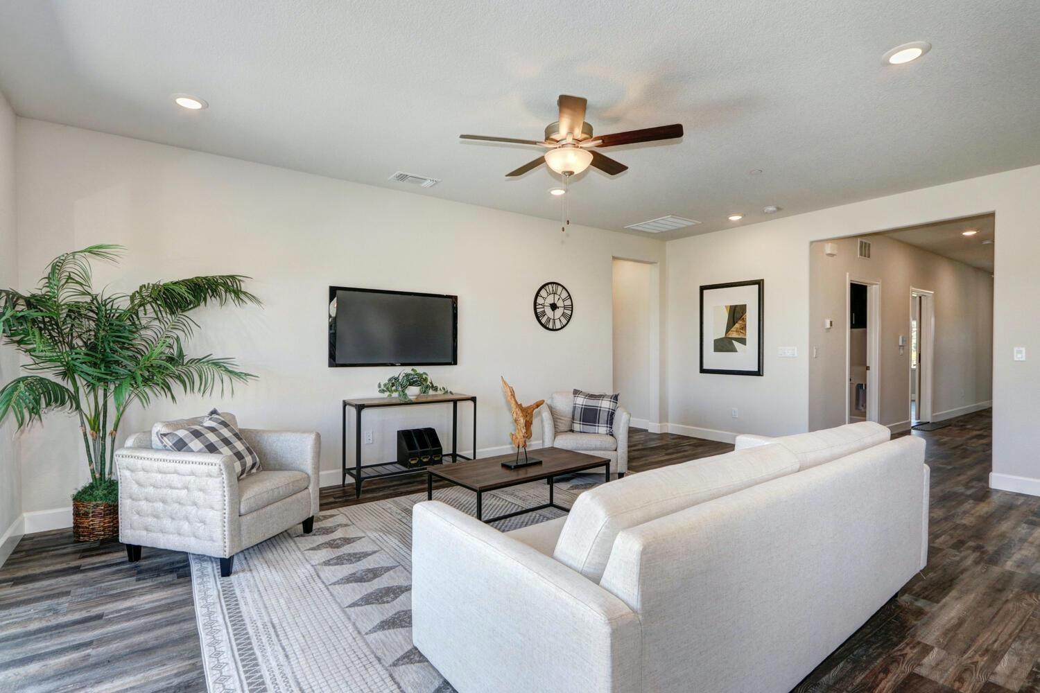 937 Norman Road Galt, CA 95632 - Photo 8 of 15 a living room with furniture and a flat screen tv