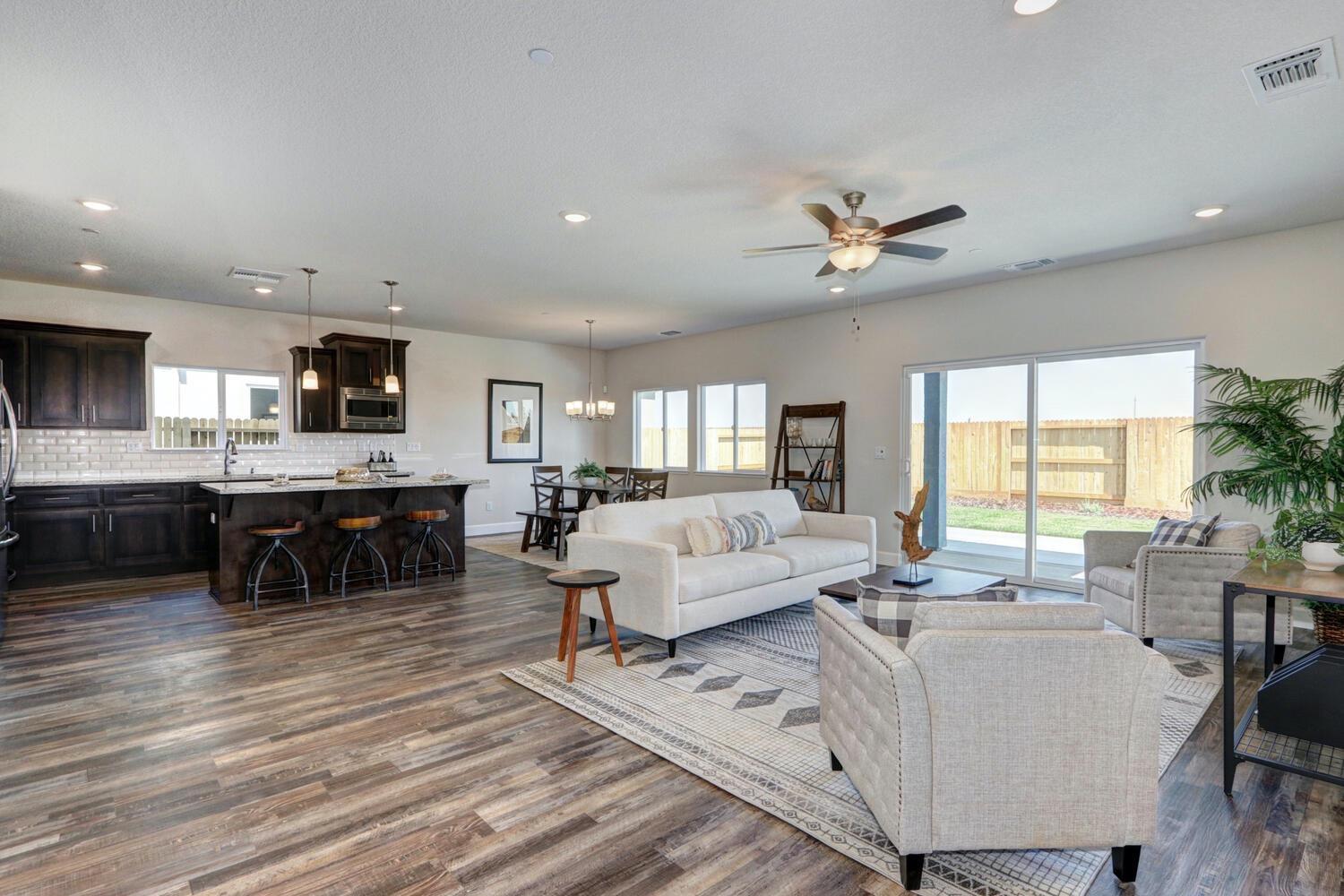 937 Norman Road Galt, CA 95632 - Photo 9 of 15 a living room with furniture and kitchen view