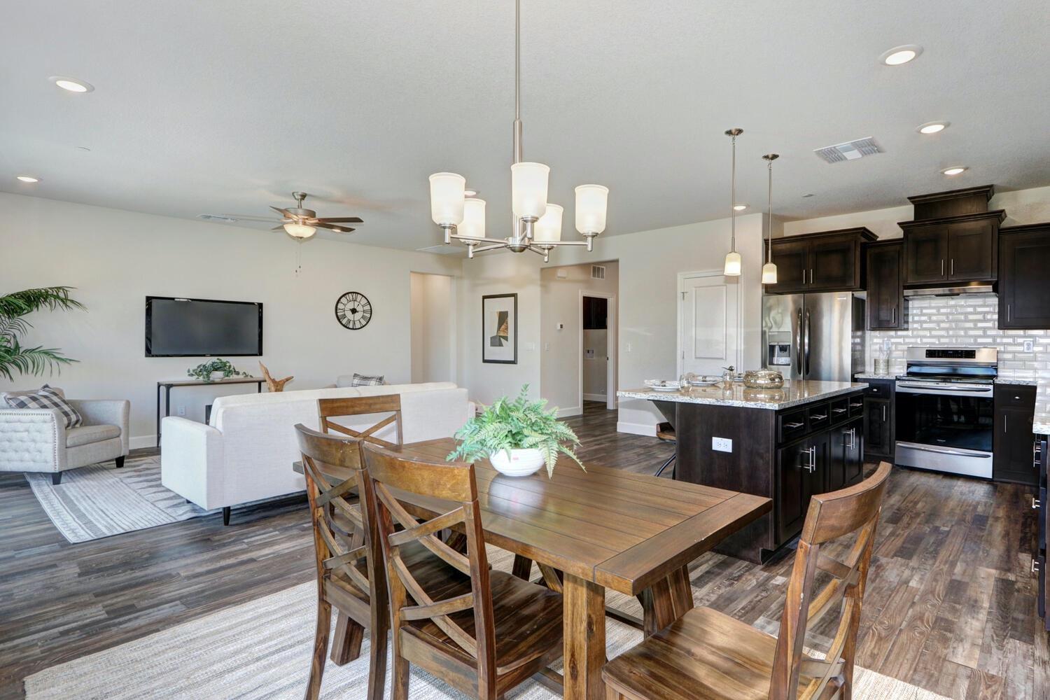937 Norman Road Galt, CA 95632 - Photo 10 of 15 a view of a dining room with furniture and wooden floor