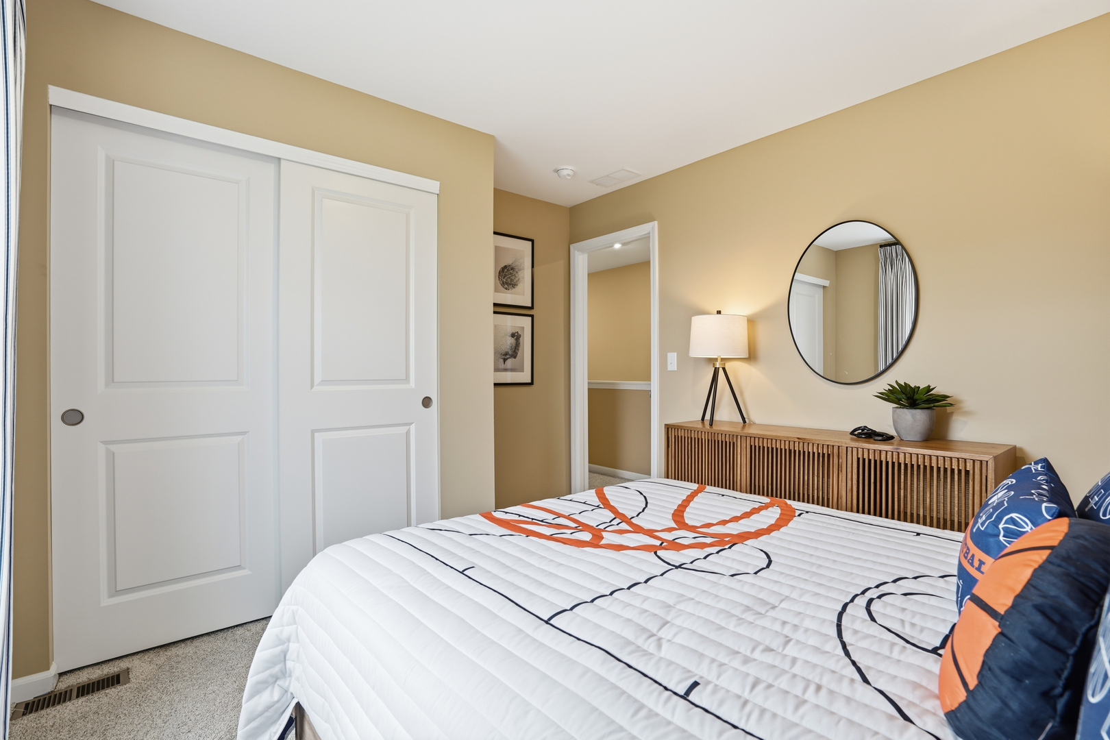 3859 Meadowridge Road Woodstock, IL 60098 - Photo 13 of 20 a bedroom with a bed a mirror and a table in it