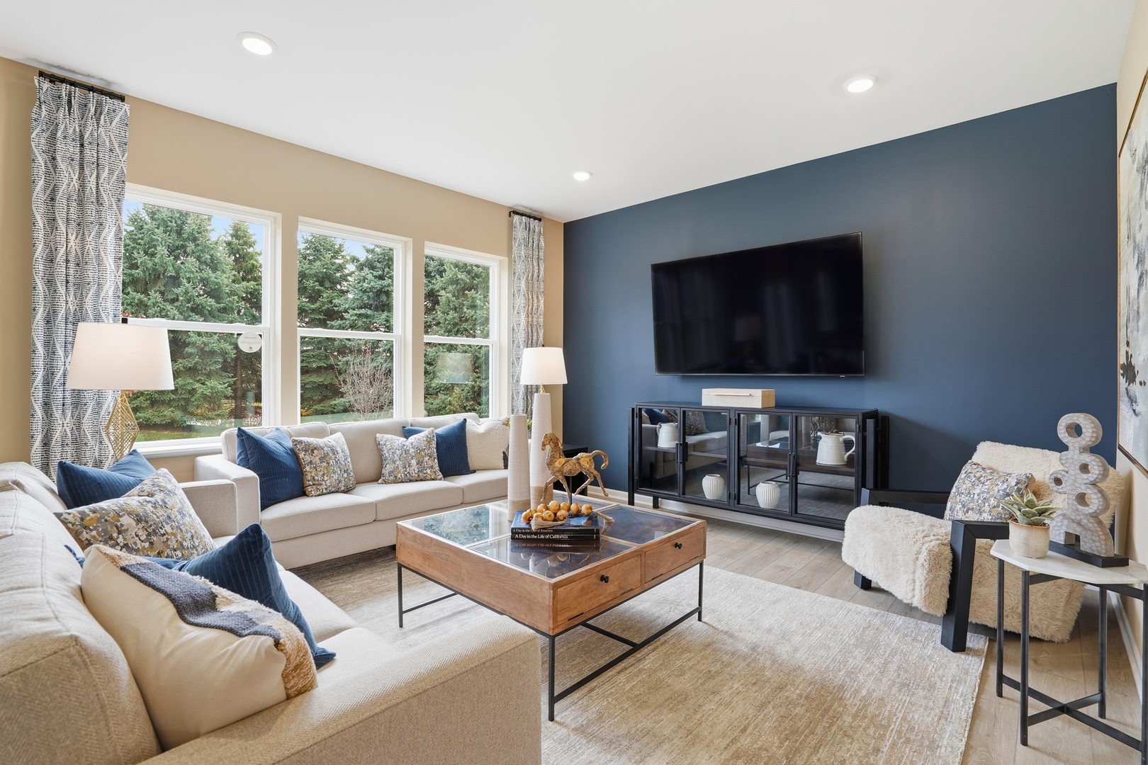 3859 Meadowridge Road Woodstock, IL 60098 - Photo 2 of 20 a living room with furniture and a flat screen tv