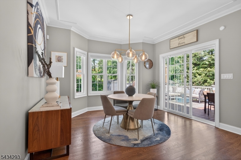 921 Harding Street Westfield, NJ 07090 - Photo 20 of 50 a dining room with furniture a chandelier and wooden floor