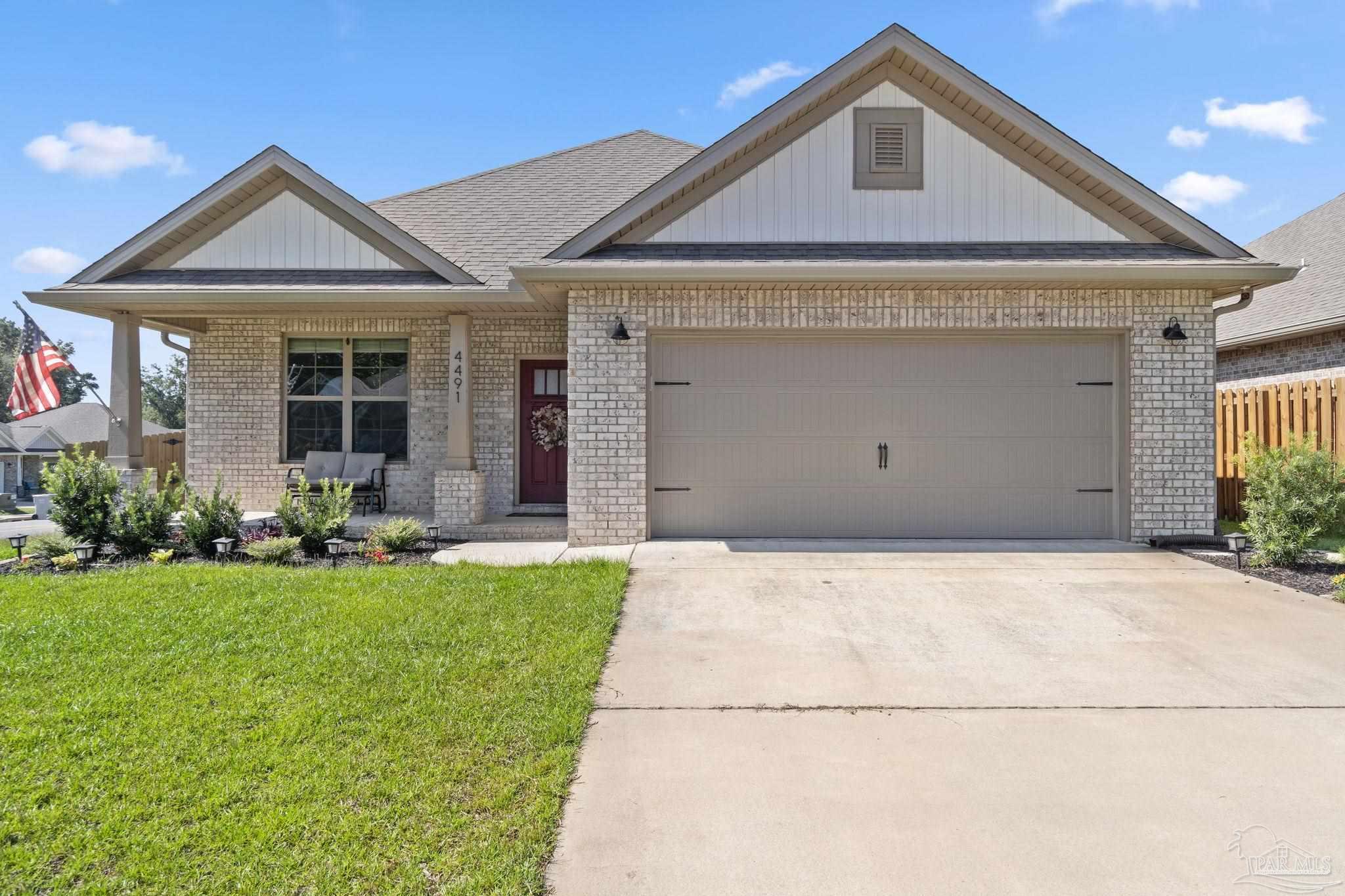 4491 Jude Way Pace, FL 32571 - Photo 1 of 36 Fully irrigated front yard and garden beds