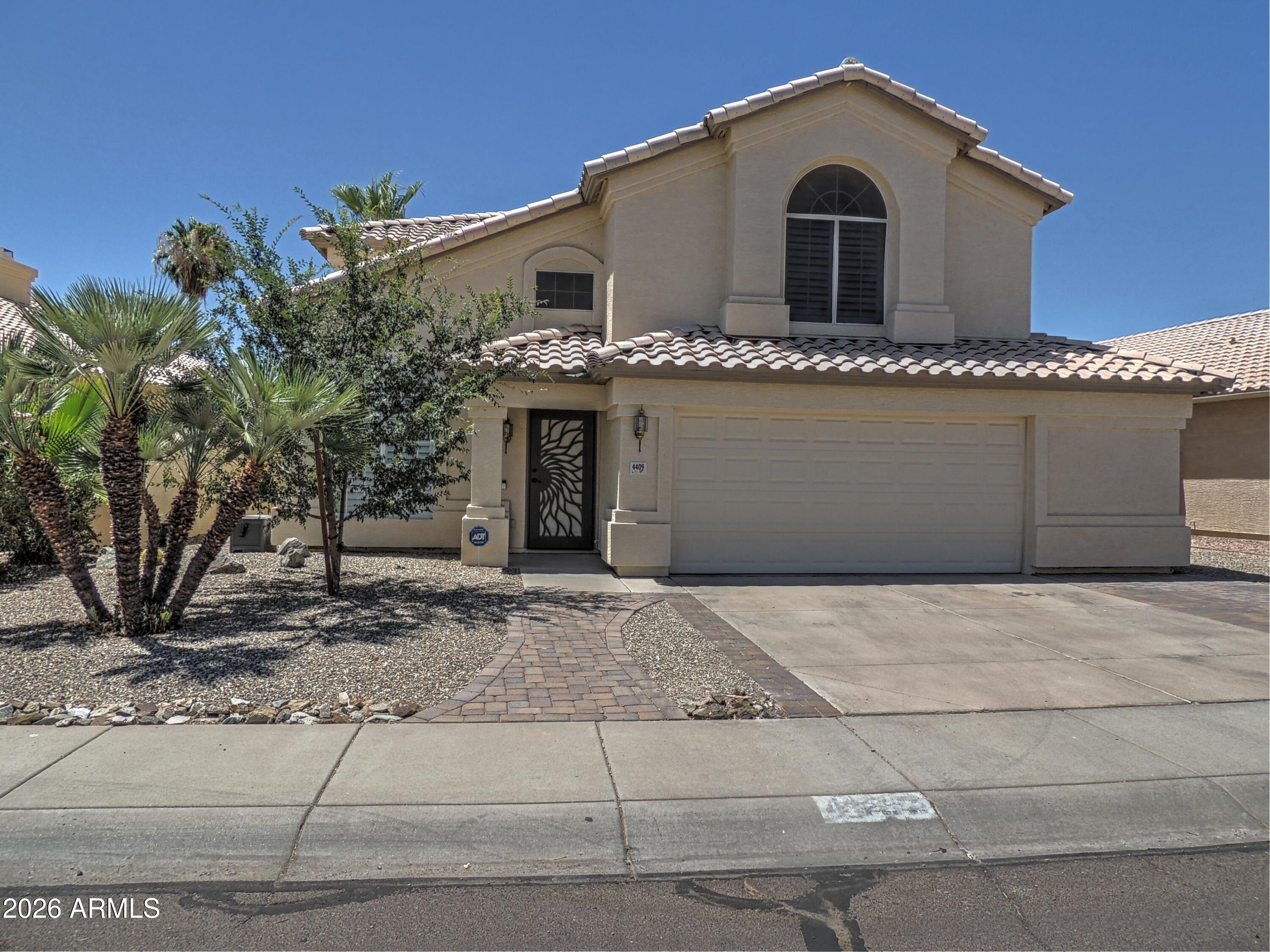 a front view of a house with a garage