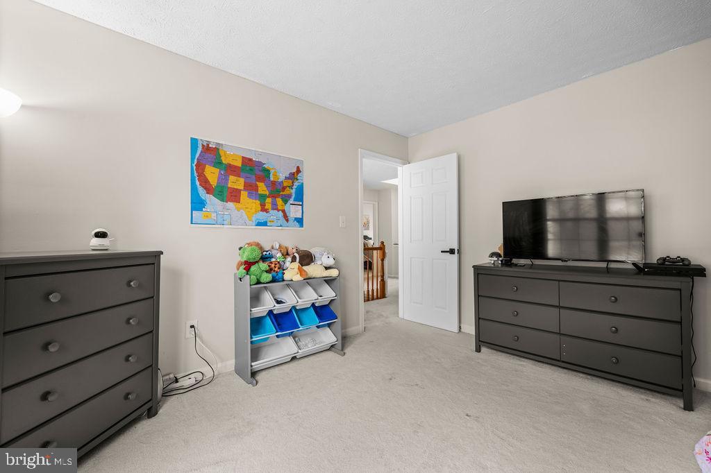 9803 Bald Hill Road Bowie, MD 20721 - Photo 27 of 55 a view of room with toys and flat screen tv