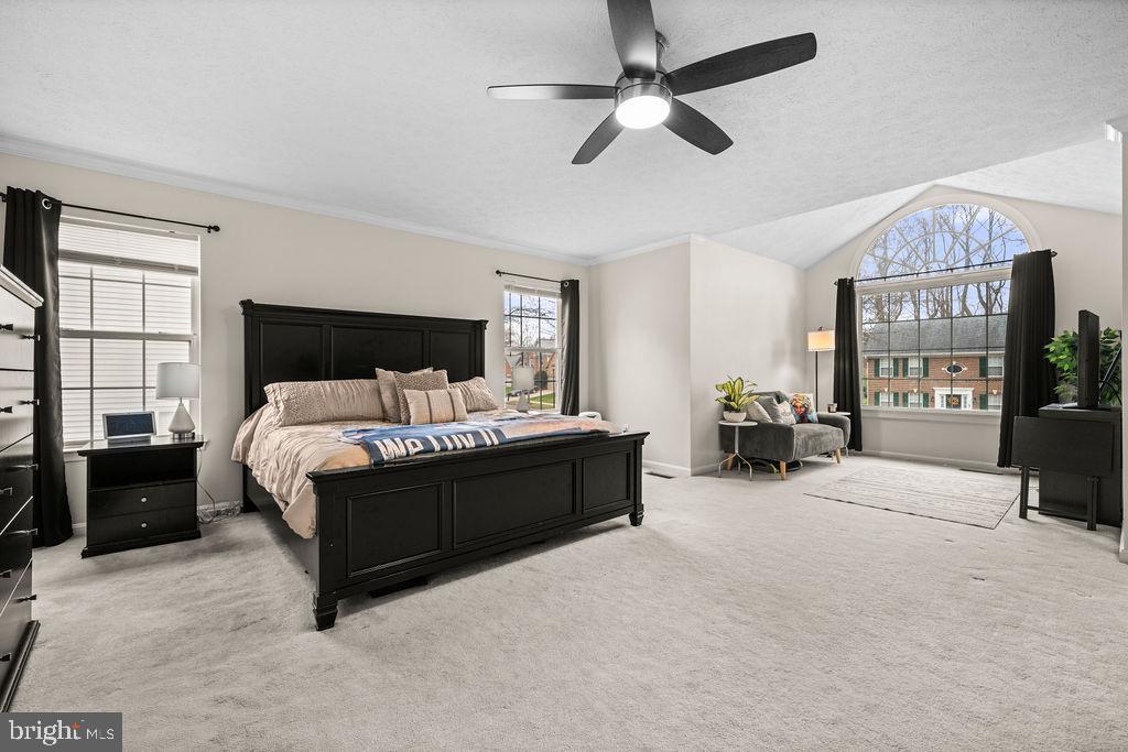 9803 Bald Hill Road Bowie, MD 20721 - Photo 29 of 55 a spacious bedroom with a bed couch and window