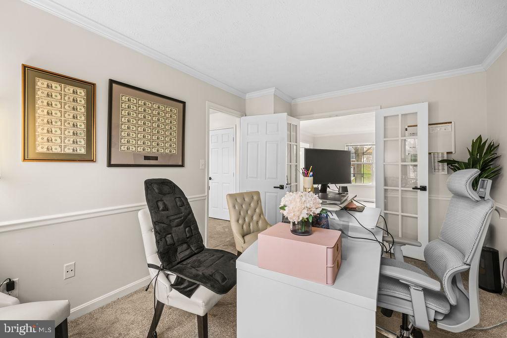 9803 Bald Hill Road Bowie, MD 20721 - Photo 37 of 55 a view of a workspace with furniture and a livingroom