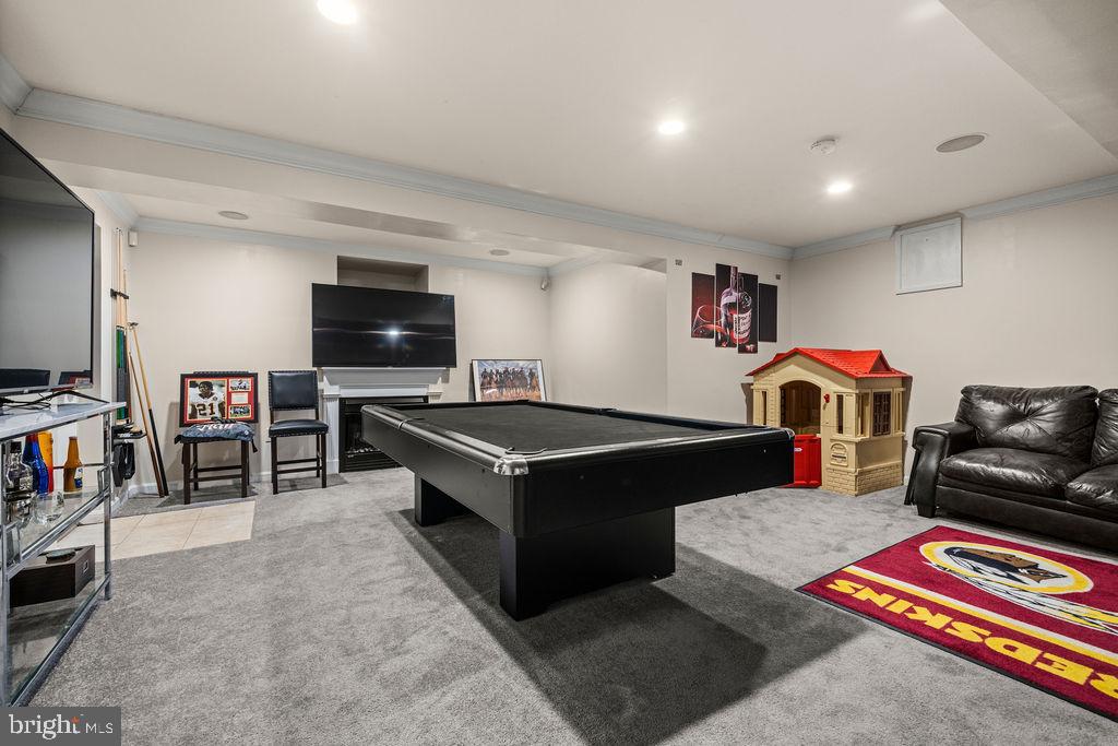 9803 Bald Hill Road Bowie, MD 20721 - Photo 38 of 55 a living room with furniture and a flat screen tv
