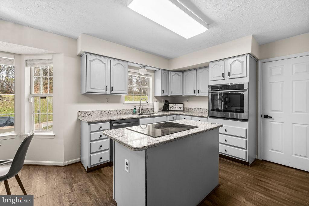 9803 Bald Hill Road Bowie, MD 20721 - Photo 4 of 55 a kitchen with cabinets appliances a sink and a window