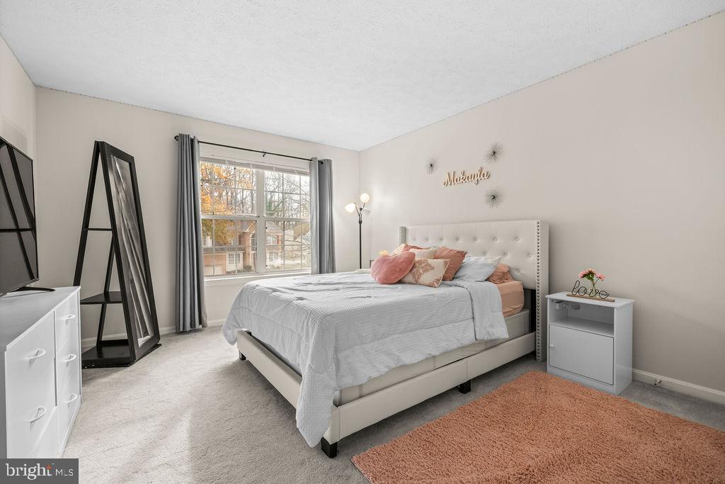 9803 Bald Hill Road Bowie, MD 20721 - Photo 5 of 55 a bedroom with a bed and a large window