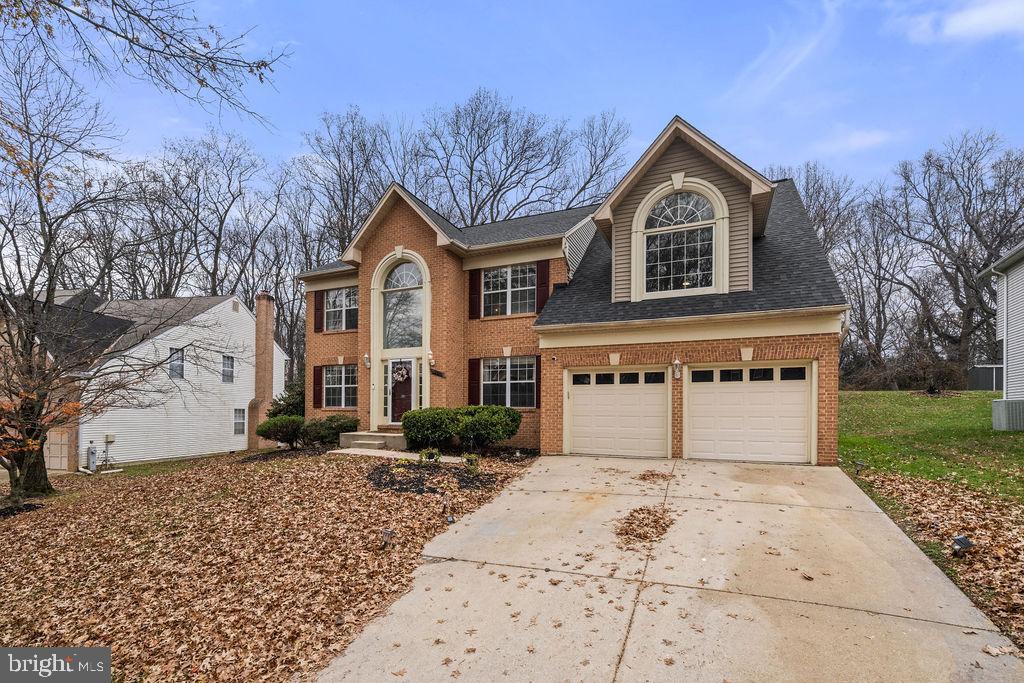 9803 Bald Hill Road Bowie, MD 20721 - Photo 55 of 55 a front view of a house with a yard and garage