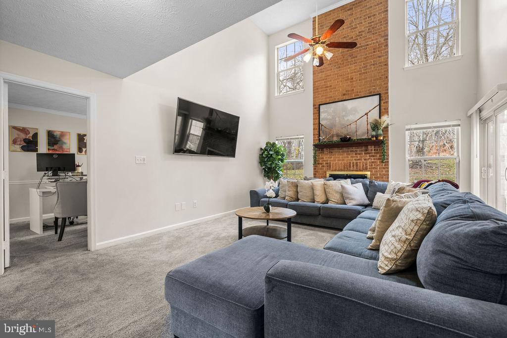 9803 Bald Hill Road Bowie, MD 20721 - Photo 9 of 55 a living room with furniture and a flat screen tv