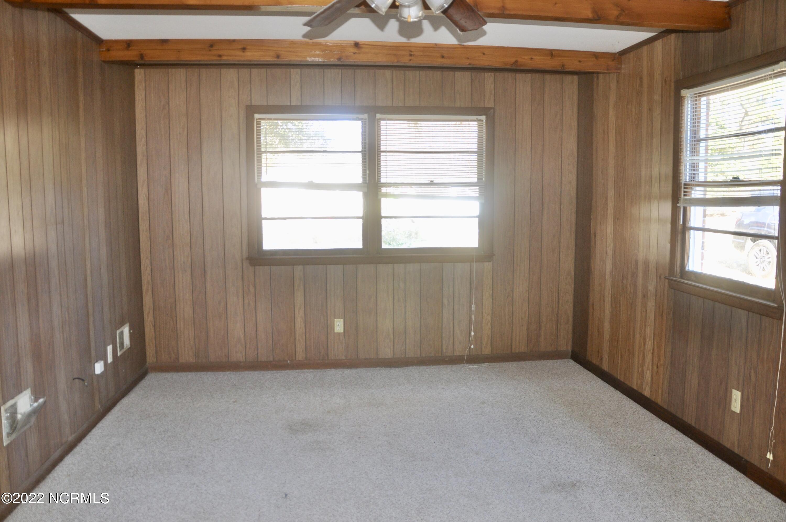 2308 Rockhill Road Castle Hayne, NC 28429 - Photo 23 of 31 Carolina room with wood beams from the side entry