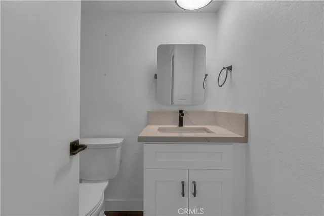 a bathroom with a sink and mirror