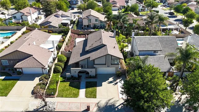an aerial view of houses with outdoor space
