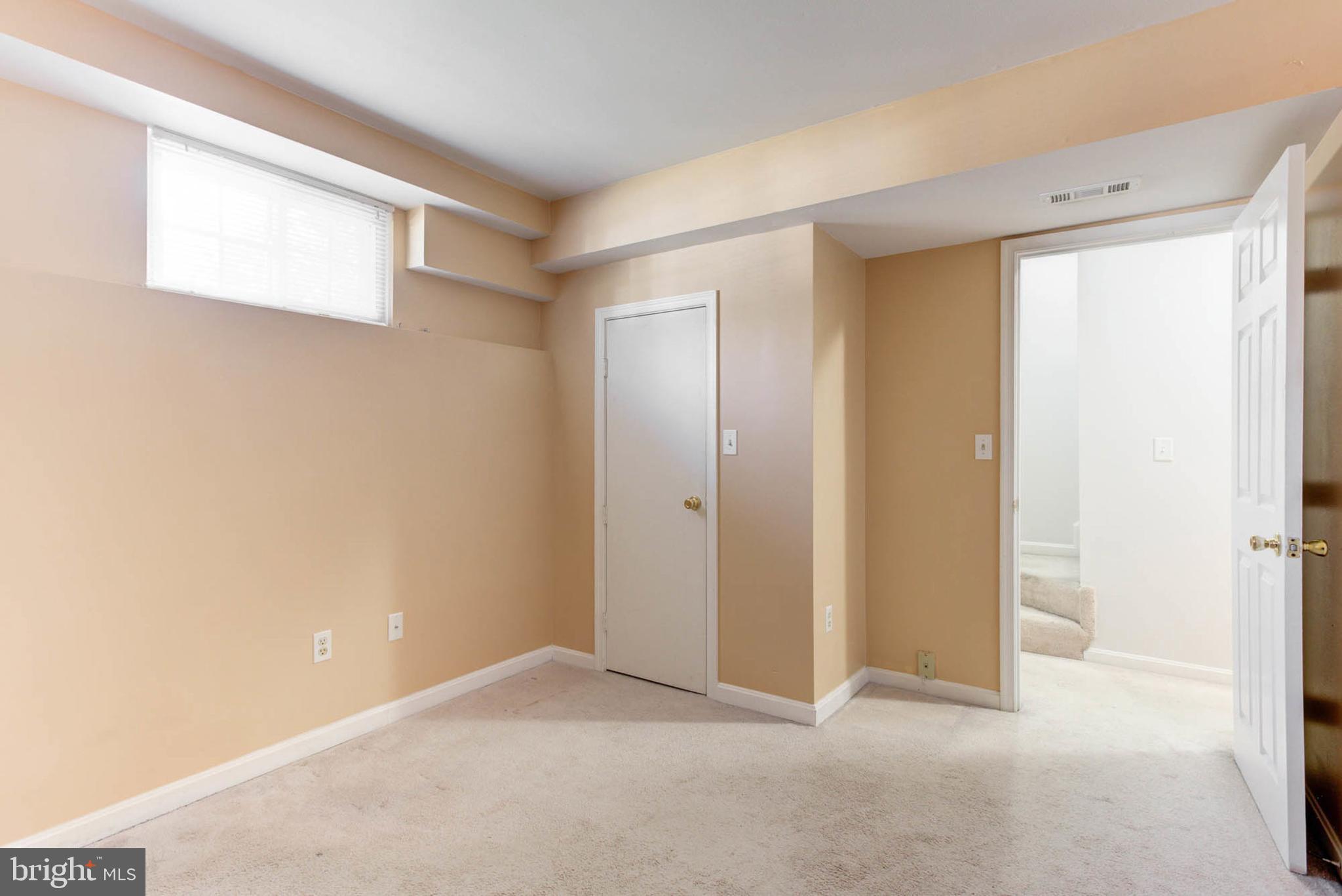 7812 Solari Court Pasadena, MD 21122 - Photo 22 of 30 a view of an empty room with a window