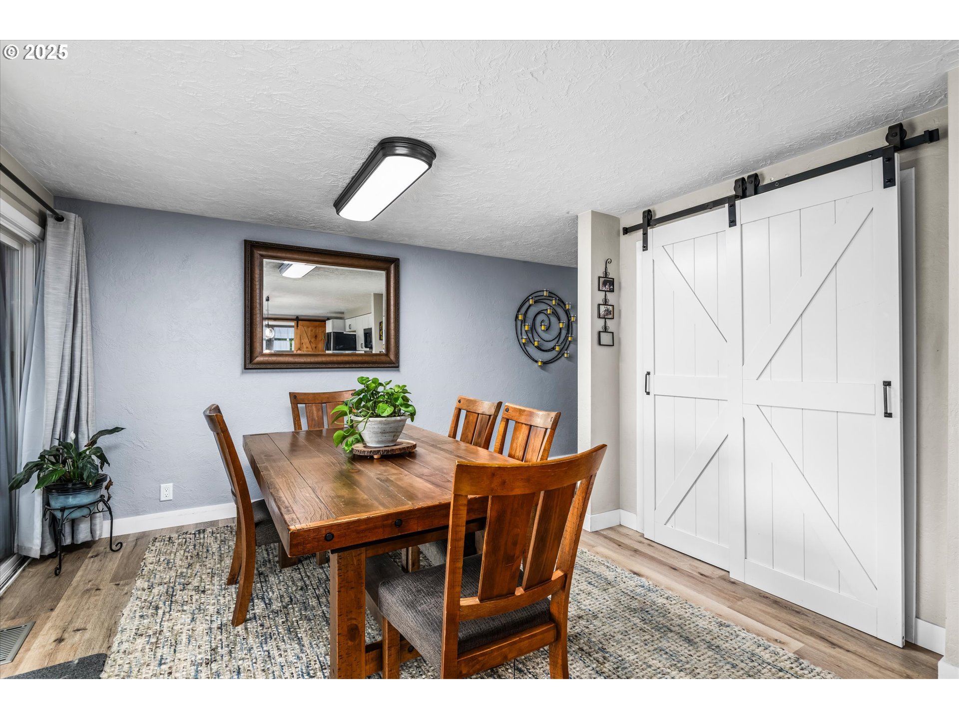 37807 Camp Creek Road Springfield, OR 97478 - Photo 11 of 40 a view of a dining room with furniture and wooden floor