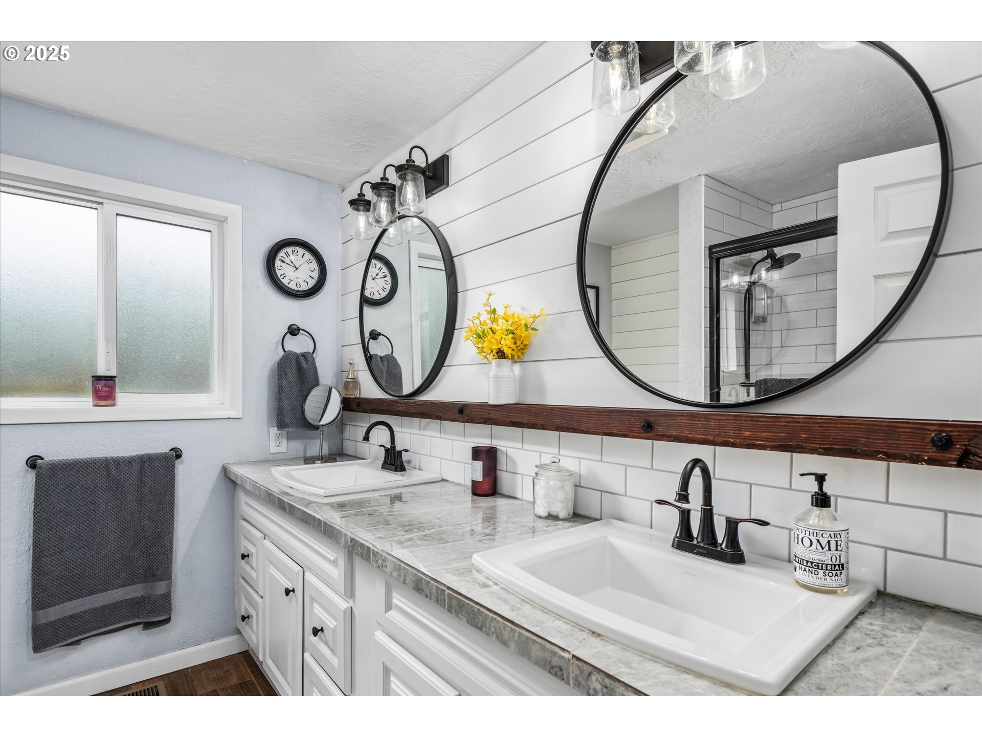 37807 Camp Creek Road Springfield, OR 97478 - Photo 20 of 40 a bathroom with a granite countertop sink mirror and vanity