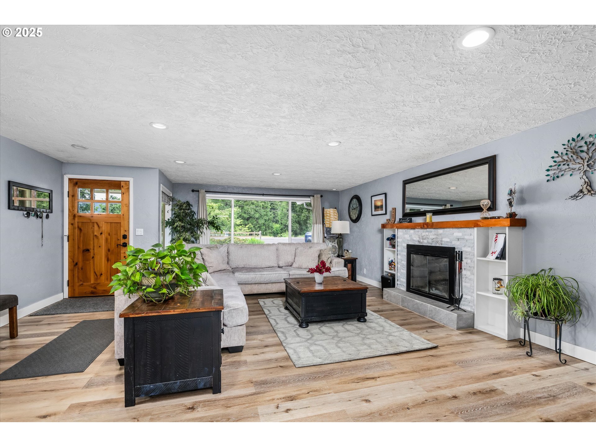 37807 Camp Creek Road Springfield, OR 97478 - Photo 6 of 40 a living room with furniture fireplace and potted plants