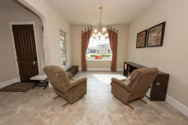 a kitchen with stainless steel appliances granite countertop a kitchen island hardwood floor sink and stove