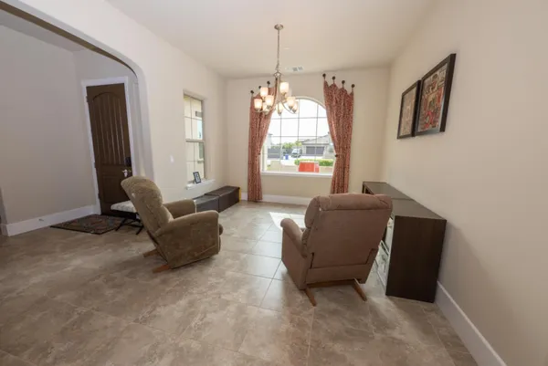 a bedroom with furniture and a window