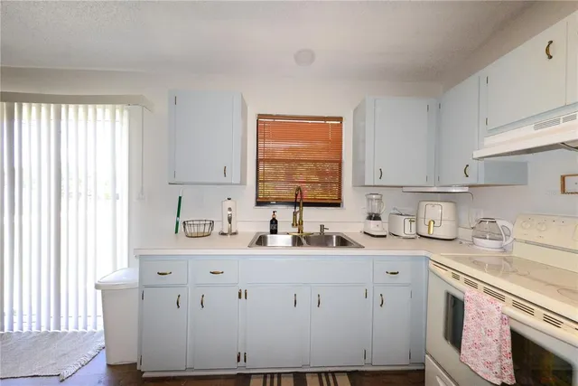 a view of a kitchen with a sink