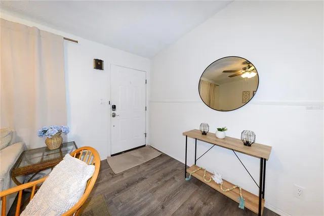 a room with a wooden floor and a chair